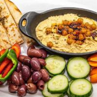 Hummus Platter · Homemade hummus, baby tricolor heirloom carrots, peppers, cucumber, olives, pita bread.