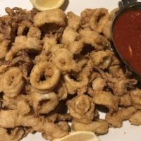 Calamari Fritti · Golden fried calamari with marinara sauce and lemon.