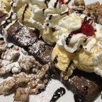 Butera Brownie For 2 · Two brownies served warm with four scoops of vanilla ice cream, whipped cream, candied walnu...