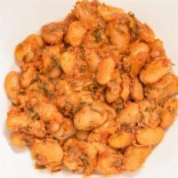 Gigantes Plaki · Giant imported lima beans baked in red dill sauce with sauteed onions.