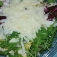 Metzovou Salad · Radicchio, endive and arugula tossed with house dressing and topped with shavings of aged ch...