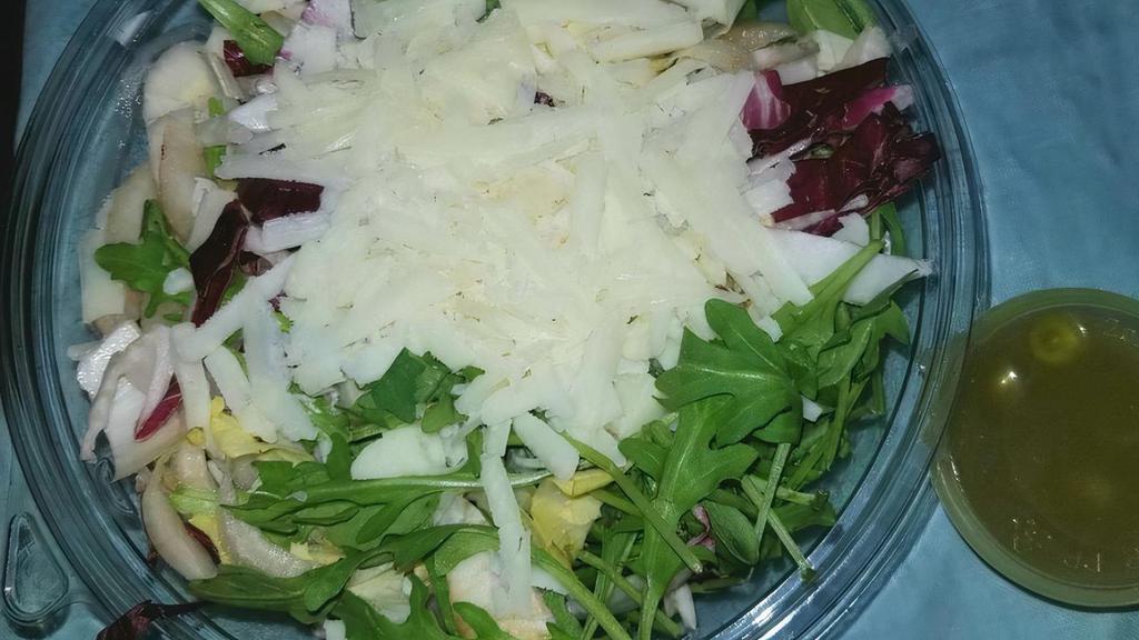 Metzovou Salad · Radicchio, endive and arugula tossed with house dressing and topped with shavings of aged cheese.