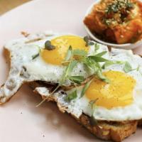 Eggs On Toast · Two poached, fried or soft scrambled eggs, kimchi side.