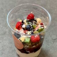 Muesli · Berry compote, Greek yogurt, seasonal fruit, macadamia crumble, coconut flakes.