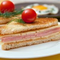 Ham, Egg & Cheese Sandwich · Slices of cooked ham, scrambled eggs and cheese topped on customer's choice of bread