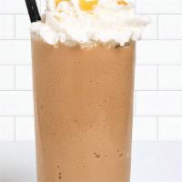 Caramel Granita · A cold and caramel-delicious granita topped with whipped cream and a sweet caramel swirl.