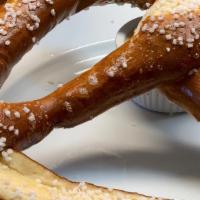 Giant Bavarian Pretzel · Giant warm pretzel served with honey mustard dipping sauce.