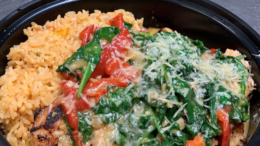 Chicken Sautéed With Spinach · Chicken breasts sauteed withn Spinach, Roasted peppers, in a garlic-butter sauce, served over rice pilaf.