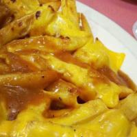 Potato Delight · With American cheese and gravy.
