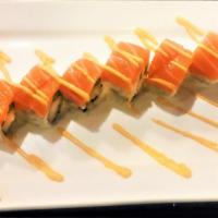 M-16 Roll · Shrimp tempura and asparagus inside, with fresh salmon and spicy mayo on top.