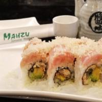 Sumo Roll · Baked eel and avocado wrapped inside out with spicy crunchy yellowtail on top, served with e...