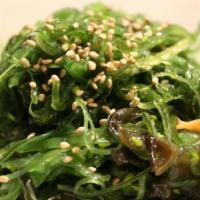 Hiyashi Wakame (Seaweed Salad) · Green seaweed salad and cucumber mixed with sesame.