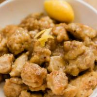 Lemon Chicken · Seasoned pieces of chicken fried until golden and crispy mixed with a sweet and sour lemon s...