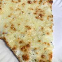 White Pizza Slice · A sauceless slice topped with ricotta, shredded mozzarella, and Parmesan cheese.