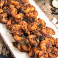 Shrimp Pepper Fry · Marinated shrimp deep fried and sauteed in pepper, onion, and hot spices.