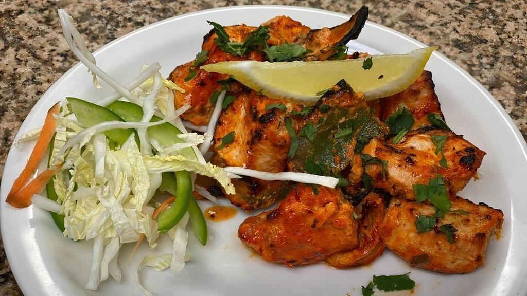Chicken Tikka · Boneless chunks of chicken marinated with  Indian herbs and spices in yogurt and grilled