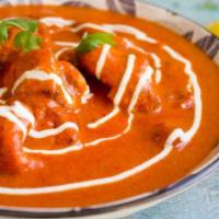 Chicken Tikka Masala · Boneless chicken cubes cooked in a rich creamy onion and tomato-based gravy.