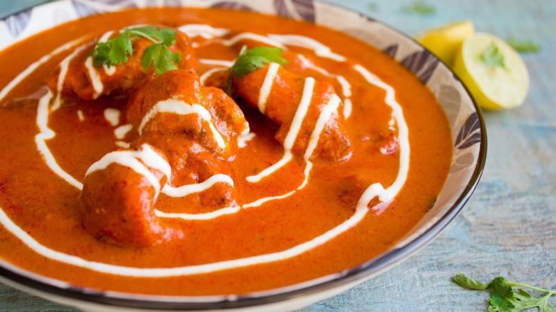 Chicken Tikka Masala · Boneless chicken cubes cooked in a rich creamy onion and tomato-based gravy.