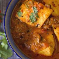 Fish Pulusu · Boneless fish with tamarind-based tangy gravy with onions and tomato.