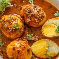 Egg Masala · Traditional Indian curry with boiled eggs simmered in an onion-tomato gravy along with hot s...