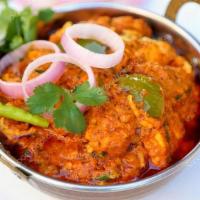 Kadai  Chicken · Boneless chicken cooked with bell pepper, onion tossed with fresh herbs and spices.