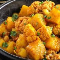 Jeera Aloo Gobi · A delicious North Indian dish made with potatoes, cauliflower, cumin spices, and herbs.