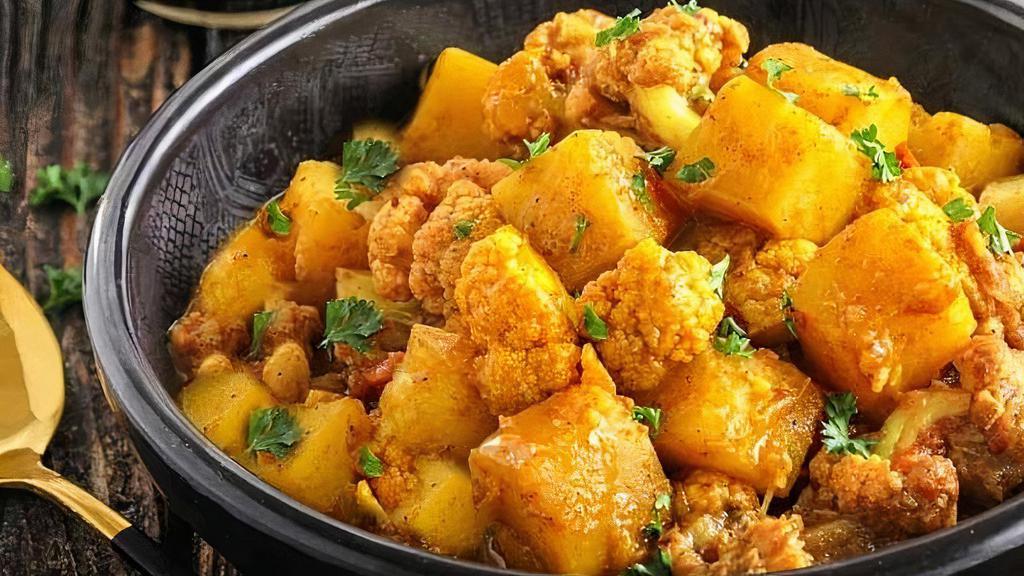 Jeera Aloo Gobi · A delicious North Indian dish made with potatoes, cauliflower, cumin spices, and herbs.