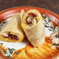 The Breakfast Wrap · Eggs with ham and bacon.