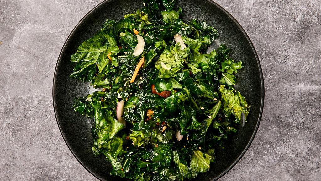 Side Of Sesame Kale Salad · Curly kale with carrots, red onions, and sesame seeds dressed with a sesame vinaigrette