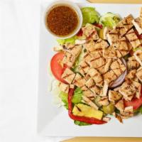 Grilled Chicken Salad · Served with bread and butter.