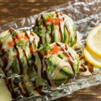 Dragon Ball(App) · Spicy tuna, surrounded by avocado, served with eel and creamy aioli sauce.