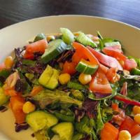 Chopped Salad · Garden greens tossed with chickpeas, cucumbers, tomato, aged balsamic, virgin olive oil.