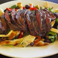 Panzanella Steak Salad · Grilled marinated skirt steak, Mixed greens, Artichoke hearts, Kalamata Olives, Roasted pepp...
