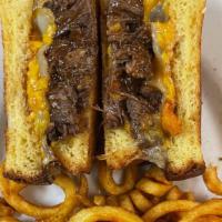 Short Rib Grilled Cheese · Barbecued pulled short ribs, three cheese melt, toasted brioche.