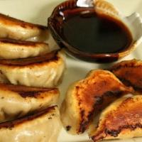 韭菜猪肉煎饺Pan-Fried Pork With Chives Dumpling · Ten pieces.