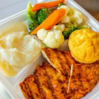 Grilled Chicken Platter · Marinated char-grilled boneless chicken breast with corn bread and two sides.