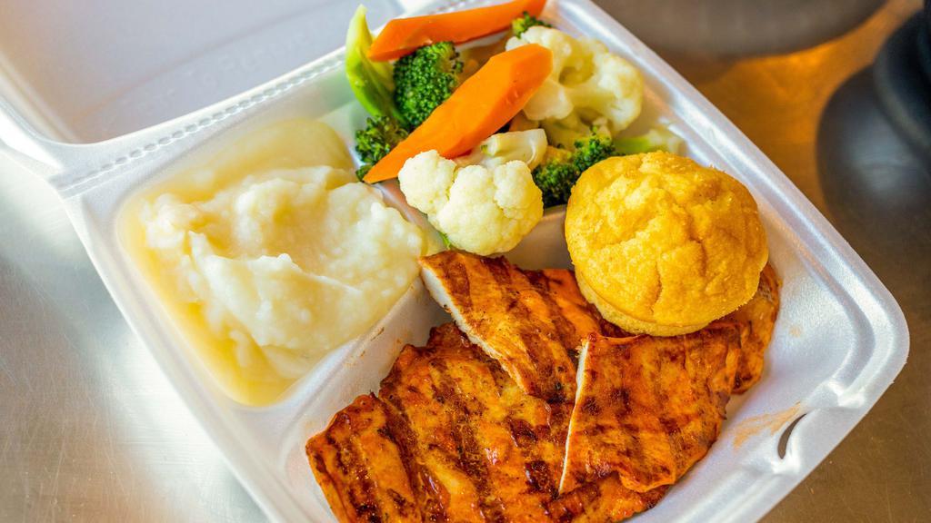 Grilled Chicken Platter · Marinated char-grilled boneless chicken breast with corn bread and two sides.