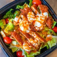 Buffalo Chicken Salad · Breaded buffalo chicken over romaine lettuce and tomatoes with Bleu cheese dressing.