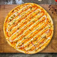 Ride The Buffalo Vegan Pizza  · Vegan buffalo chicken topped on a pie with homemade tomato sauce, vegan cheese, and a blend ...