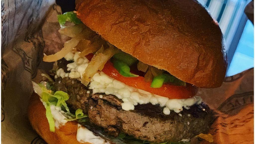'Pyramid' Village Lamb Burger · Natural, grass fed, antibiotic and hormone free. Goat cheese, lettuce, tomato, sautéed onions, green peppers, cilantro and tzatziki sauce.