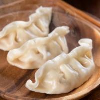 Dim Sum · Five pieces of delicious steamed dumplings.