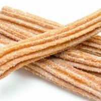 Churros · Traditional churros coated in sugar and cinnamon.