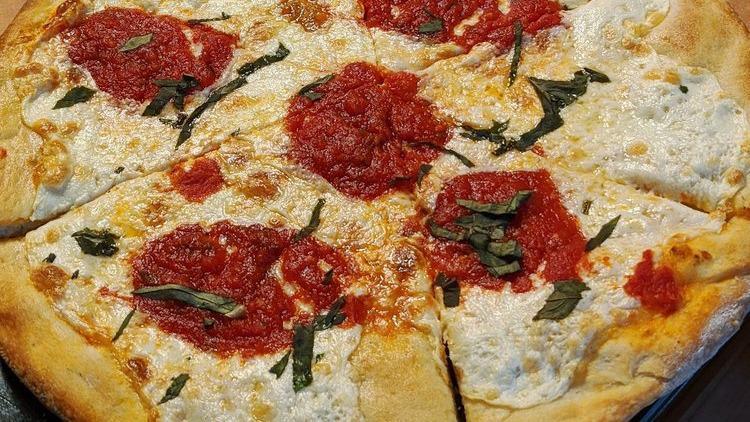 Traditional Cheese Pizza · Tomato Sauce and Mozzarella.