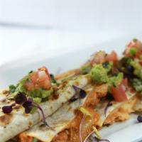 Quesadilla · Flour tortilla stuffed with cheese & grilled. Served with guacamole, jalapeños & pico de gal...