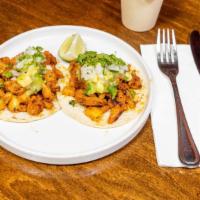 Tacos Al Pastor (2) · Roast pork marinated with Mexican spices, pineapple & tomatillo-jalapeño salsa. Topped with ...