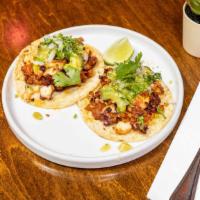 Tacos De Pulpo · Sauteed Octopus & Mexican chorizo served with tomatillo and avocado salsa and sprinkled w/on...