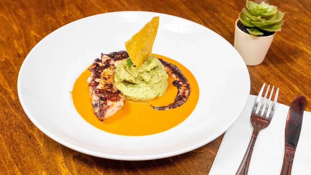 Pulpo Al Grill · Grilled Octopus served with roasted red pepper/agave sauce and avocado hummus.