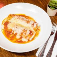Burritos De Camarones · 2 burritos filled with shrimp in chipotle sauce. Topped with cheese & sour cream. Served wit...