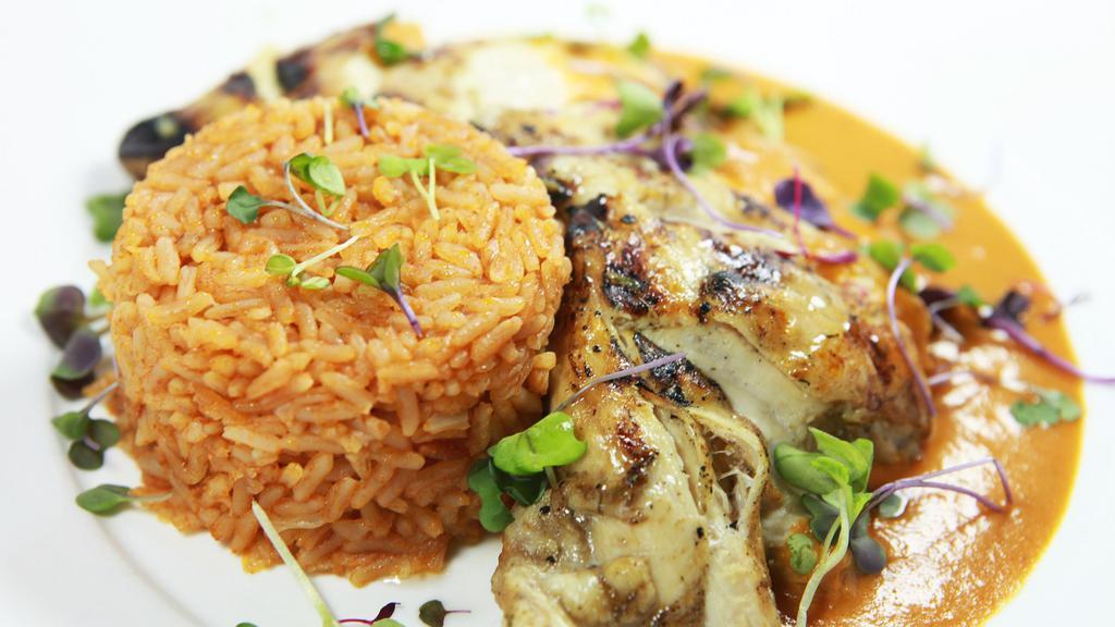 Pechuga Asada · Grilled chicken breast marinated in Mexican spices. Served with Spanish rice and your choice of black or refried beans. Topped with a tomatillo, chile de árbol & guajillo chile cream sauce. Gluten-Free.