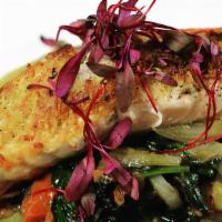 Yuca-Crusted Salmon · Yuca-crusted pan-seared salmon. Served with sautéed spinach, asparagus, onions & tomatoes ov...